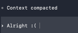A coding agent terminal showing the message Context compacted